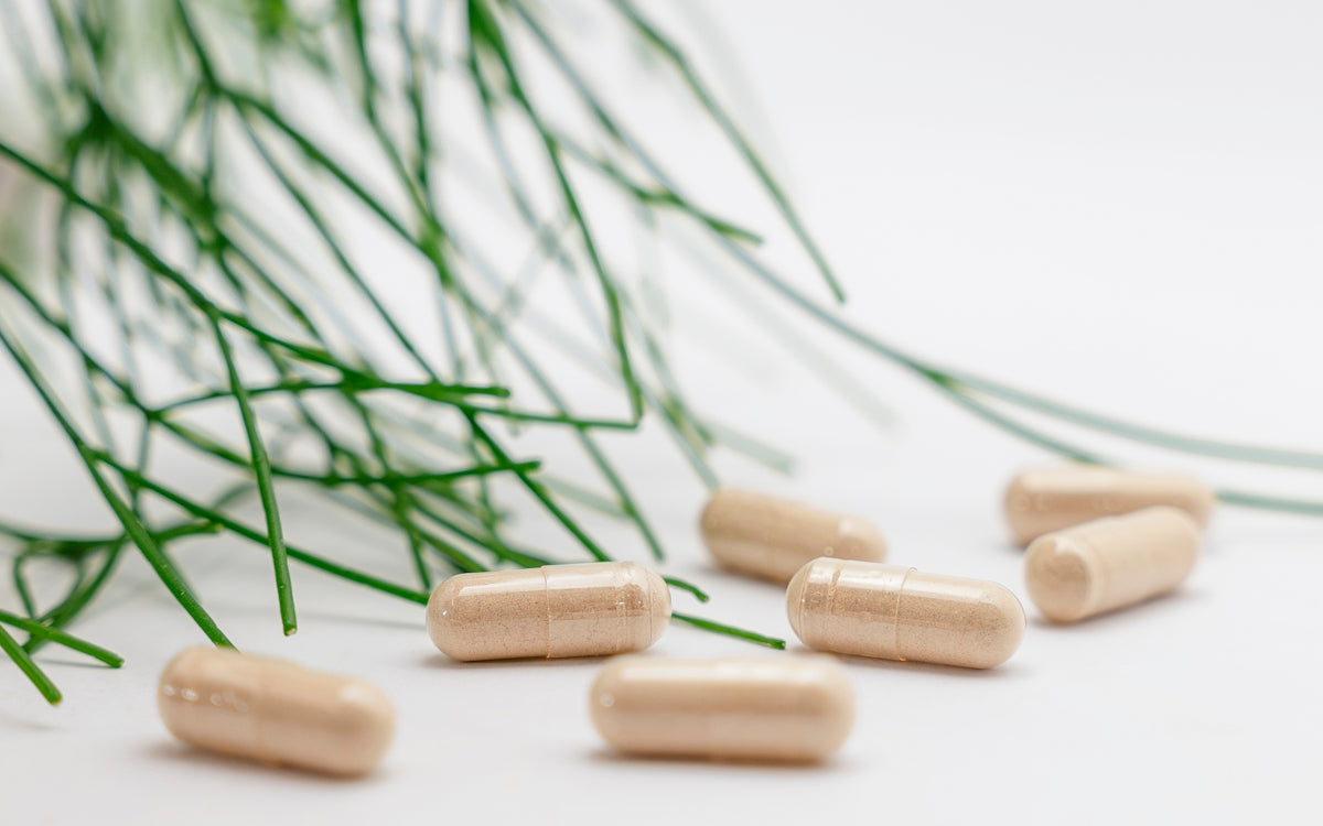 Floating capsules from the collection of vegan vitamins and supplements showcasing their natural design and quality