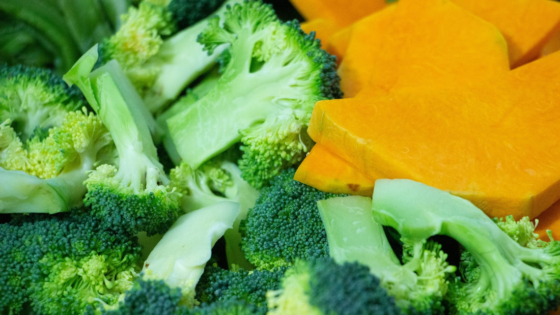 A close up of broccoli and carrots on a plate