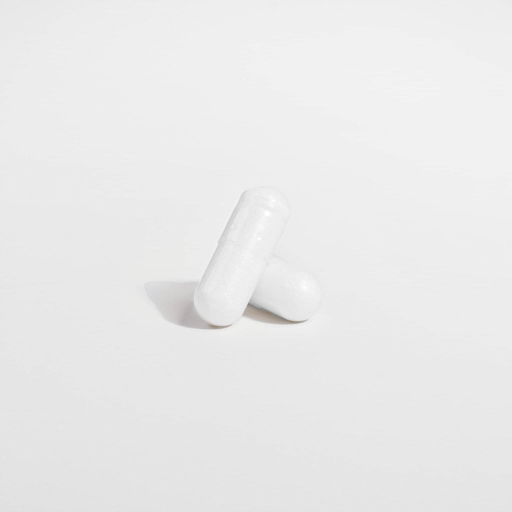 SACRAHAUS magnesium glycinate vegan supplement capsules on a white background