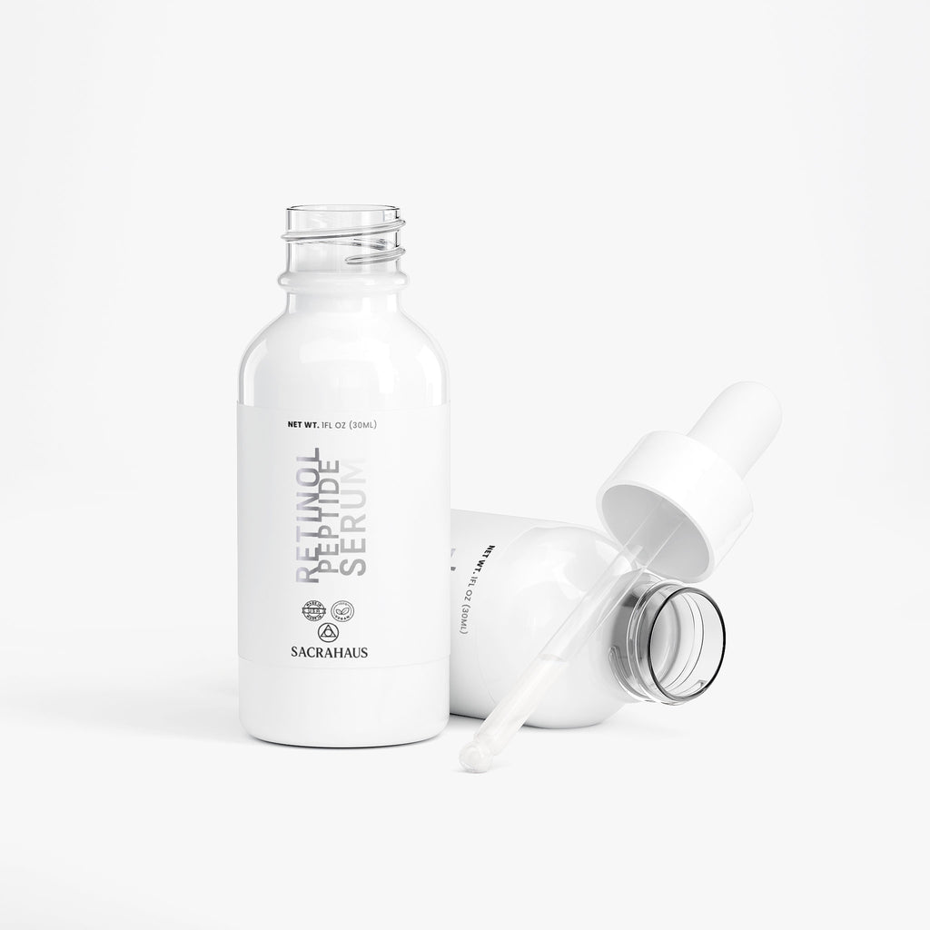 SACRAHAUS retinol peptide face serum in white bottle with dropper for anti-aging skincare