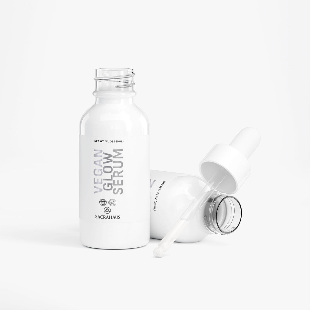 SACRAHAUS vegan glow serum in white bottle with dropper for radiant skin care