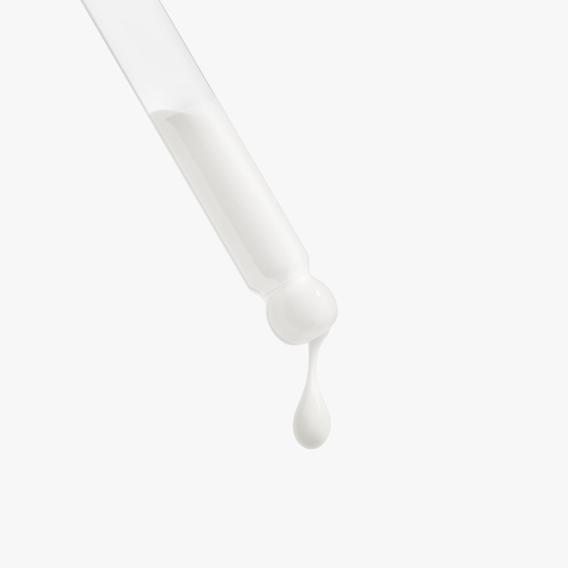 SACRAHAUS vegan glow serum dropper with a shimmering drop of serum ready for application